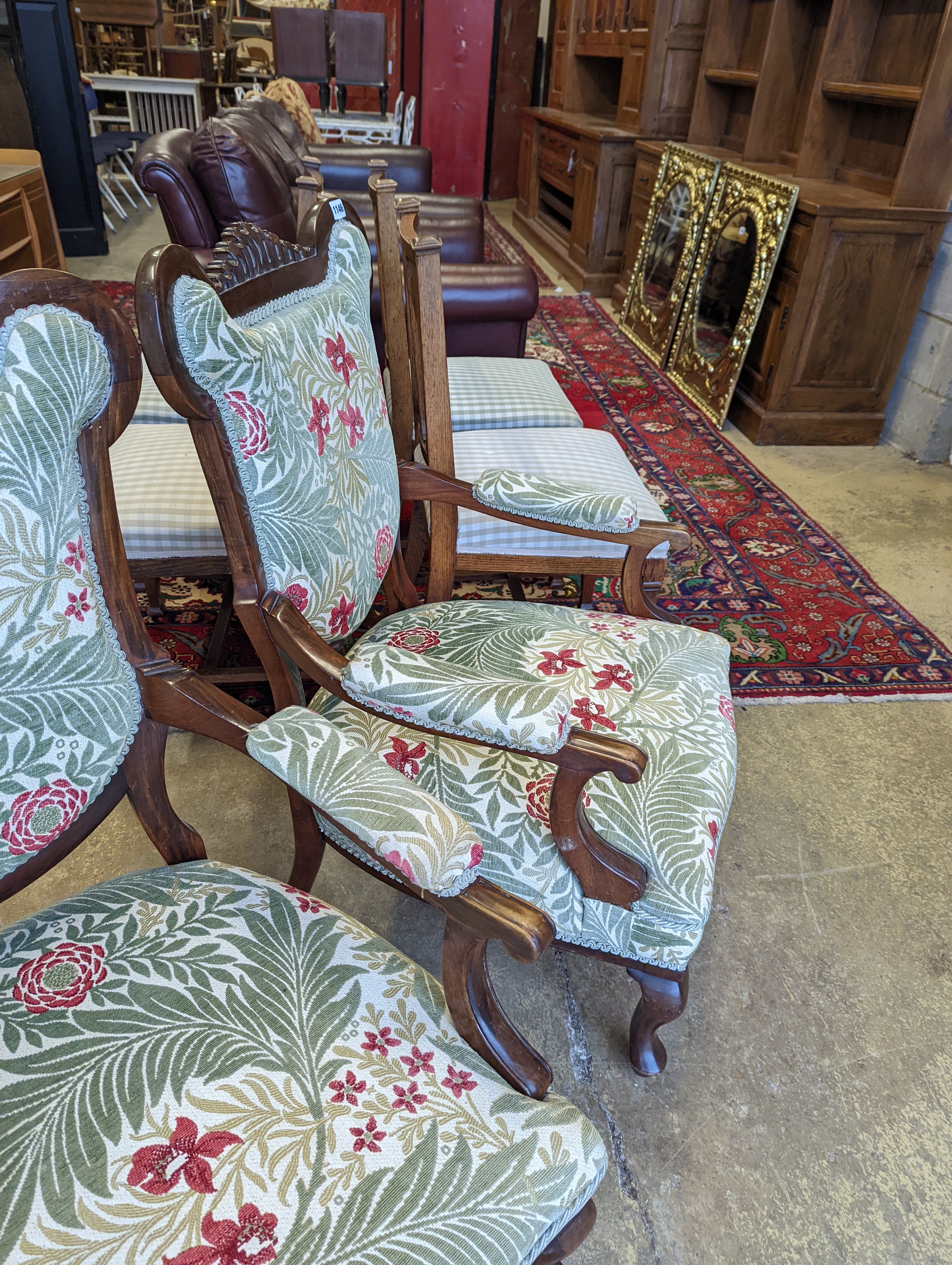 A pair of late Victorian mahogany upholstered drawing room chairs